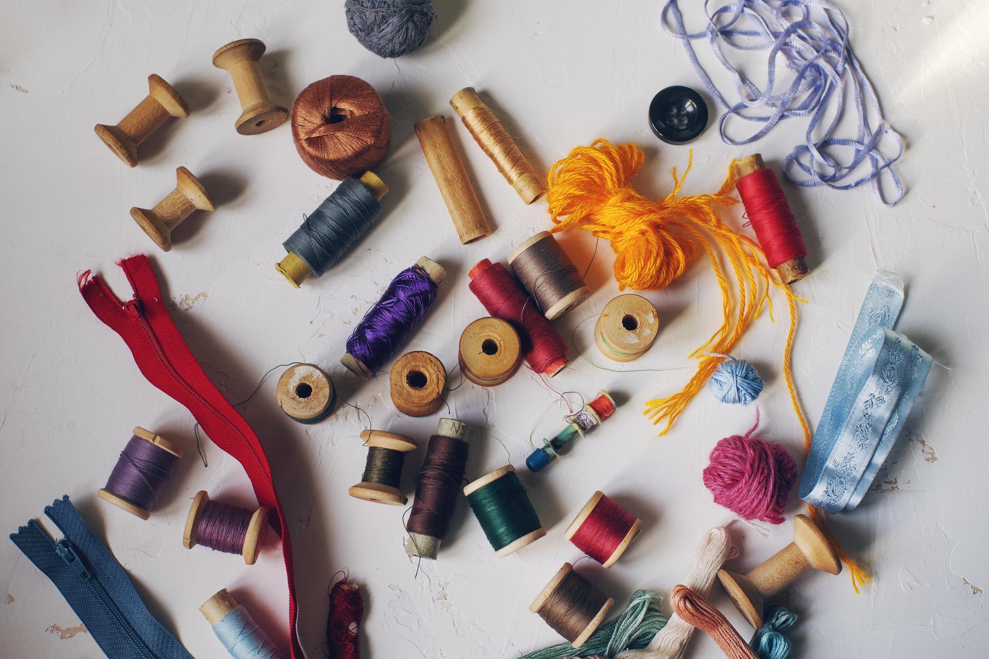 Assorted embroidery threads and tools